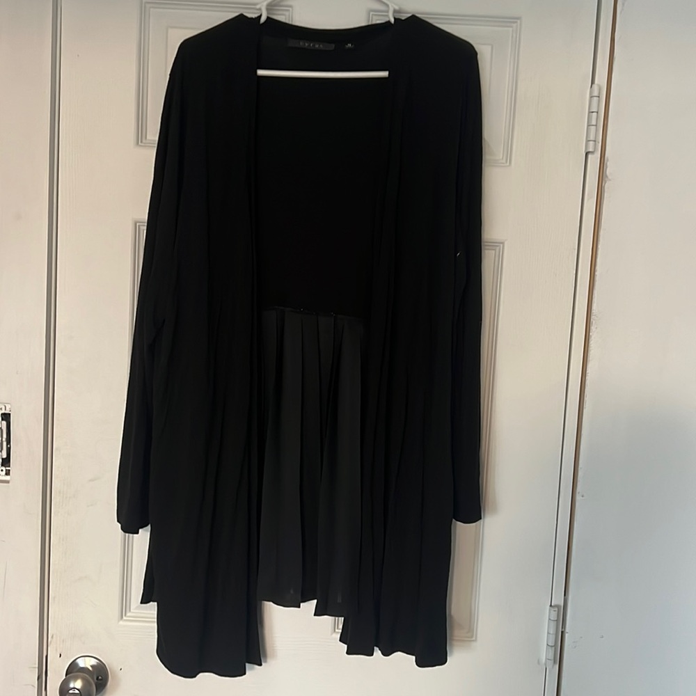 Long sleeve sweater, bottom half of the back is sheer.